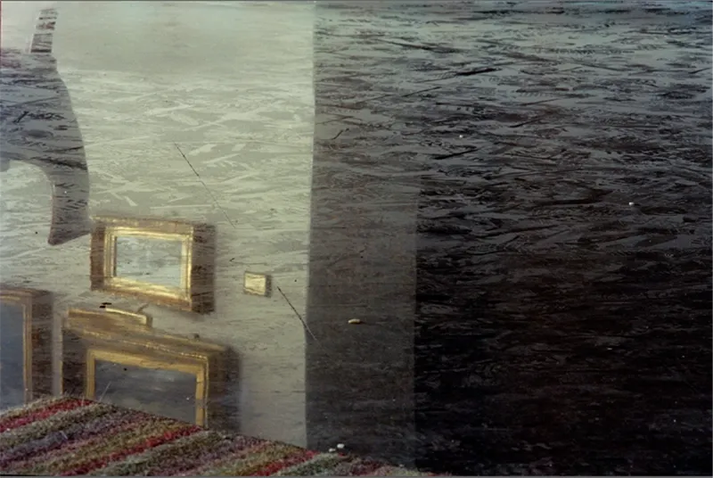 Desde Adentro — Door covered in ash film